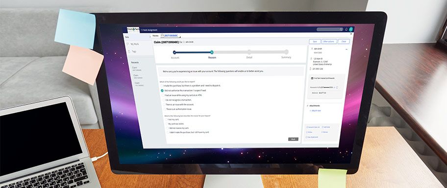 Desktop computer with QFD automated dispute management software open in a window.